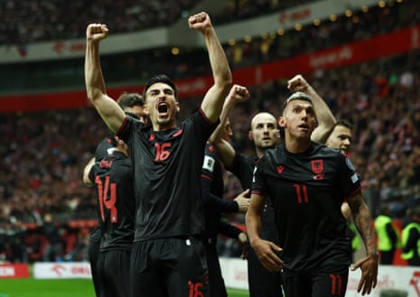 Albania's Juljan Shehu and Myrto Uzuni celebrate Arber Hoxha scoring their first goal.