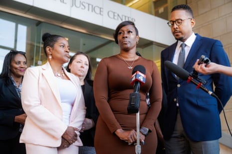 Crystal Mason speaks into microphones at a news conference outside a courthouse