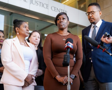 Crystal Mason flanked by supporters speaking to press