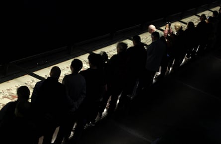 Visitors view the Bayeux tapestry on display at the British Museum