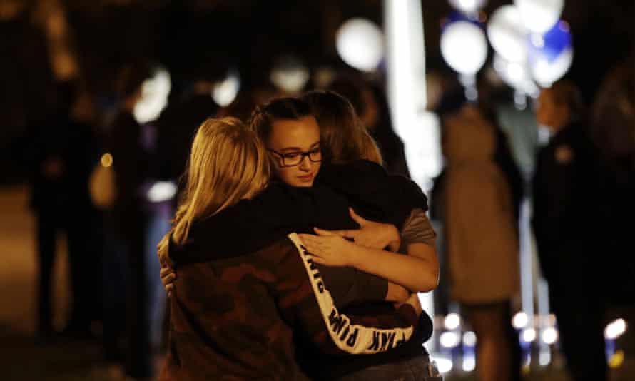 Students embrace during a vigil in the aftermath of the shooting at Saugus high school.
