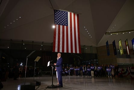 Joe Biden addresses the media and a small group of supporters with his wife Dr Jill Biden during a primary night event on 10 March in Philadelphia, Pennsylvania.