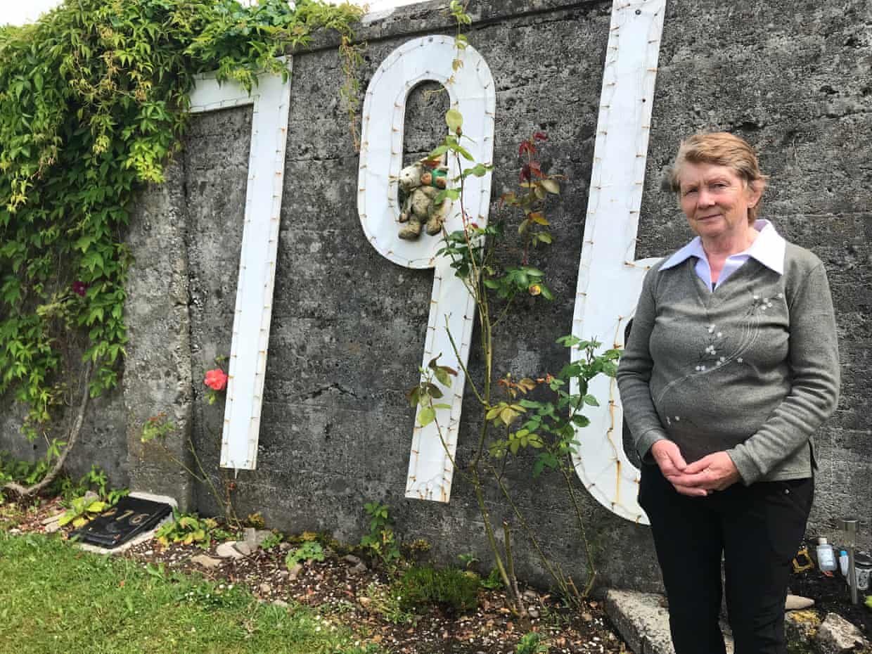 Catherine Corless stands by a stone wall at the former Tuam mother and baby home site where the figure ‘796’ is attached to the wall