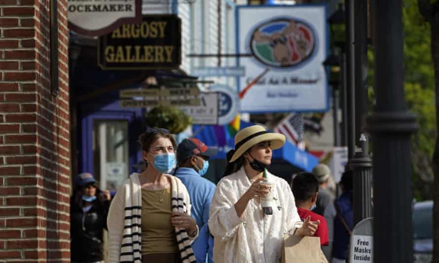 Visitors walk on a busy sidewalk in Bar Harbor, Maine, last month as Governor Janet Mills eliminated most outdoor distancing requirements imposed during the pandemic.
