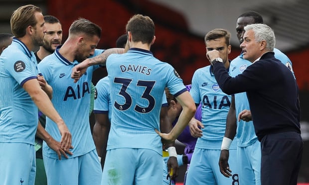 Jose Mourinho (right) talks to his players in a drinks break during Tottenham’s 0-0 draw at Bournemouth.