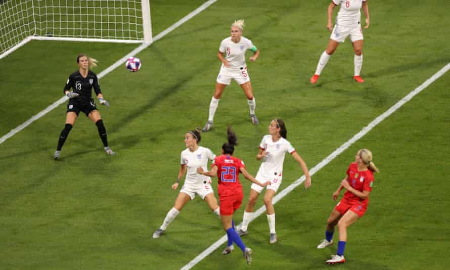 Christen Press (23) rises above England’s Lucy Bronze to open the scoring for the USA.