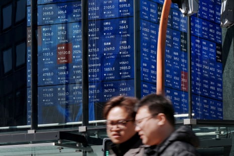 An electronic quotation board displays the Nikkei 225 stock prices on the Tokyo stock exchange on Thursday