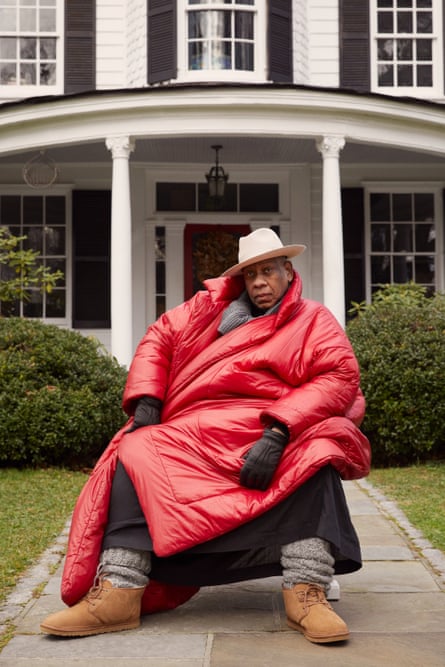 The late US Vogue editor Andre Leon Talley in a 2021 campaign for Ugg, wearing Ugg boots and big red padded coat
