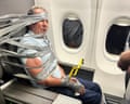 a man is duct taped to a seat in an airplane
