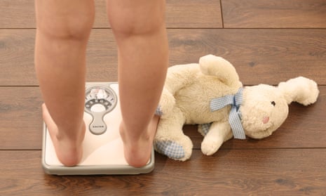 A child on bathroom scales