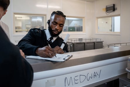 Chibs Ekeiwu signs for a kitchen delivery