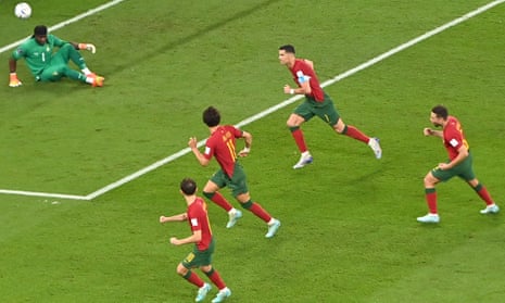 Cristiano Ronaldo (C) of Portugal celebrates scoring the opening goal from the penalty spot
