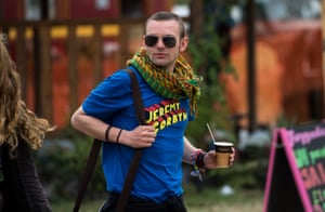 A man walks through the festival site wearing a Jeremy Corbyn t-shirt