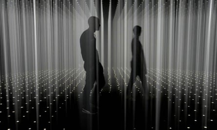 Two people walk through an installation in Florida