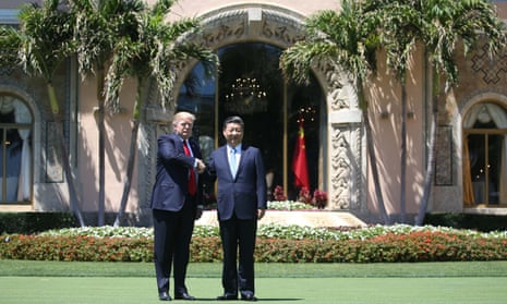 Donald Trump shakes hands with Xi Jinping at Mar-a-Lago in south Florida.