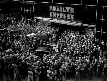 Crowds gather at the entrance to the Daily Express building, Fleet Street, London, to greet English aviator Amy Johnson in December 1932.