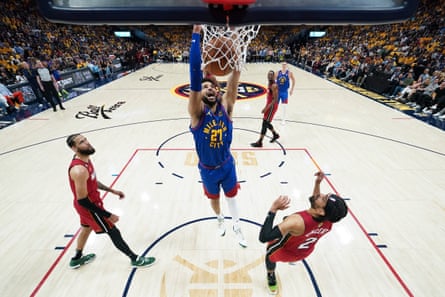 The Nuggets’ Jamal Murray throws down a dunk during the first half of Thursday’s opening game of the NBA finals in Denver.