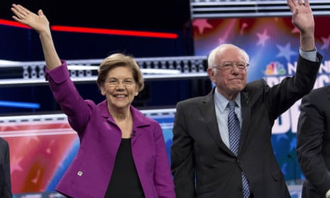 Elizabeth Warren and Bernie Sanders appear at a Democratic debate in February. 