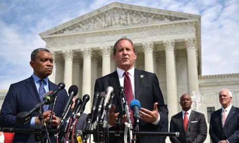 Karl Racine, the attorney general for Washington DC, and Texas attorney general, Ken Paxton, speak outside of the US supreme court in Washington, DC on 9 September 2019.