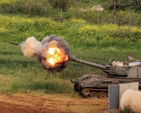 An Israeli self-propelled howitzer artillery gun fires towards southern Lebanon from a position in the upper Galilee in northern Israel on Thursday