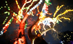 A woman prays during a ceremony to celebrate the new year at a temple in Seoul, South Korea.