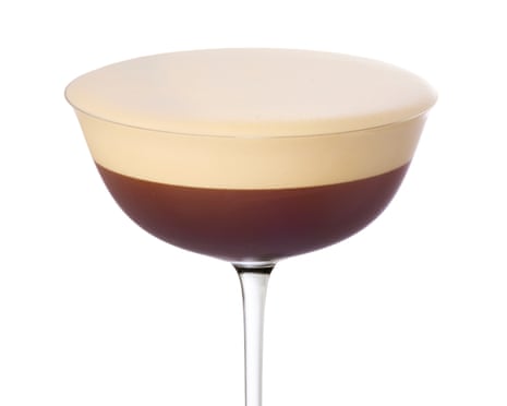 A cocktail in a tall-stemmed glass