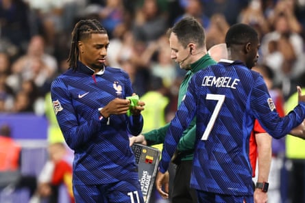 Michael Olise looked confused after being given the armband.