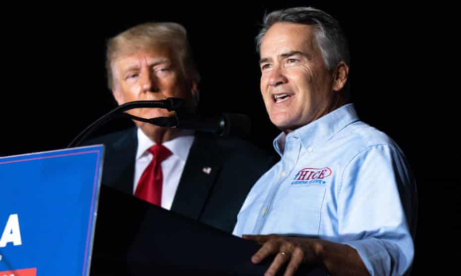 trump stands behind podium as hice speaks