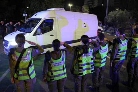Van driving past saluting Israeli officials