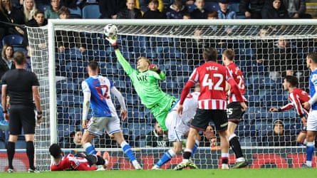 The Blackburn goalkeeper, Balazs Toth, makes a diving save during the Championship match against Sheffield United.