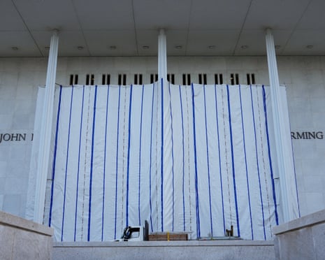 A tarp covers the facade of the John F Kennedy Memorial Center for the Performing Arts, following a federal judge’s order to remove Donald Trump’s name.