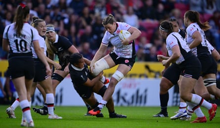 Sophie de Goede of Canada crashes through the New Zealand defence