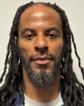 A photo of a man with dreadlocks and a short beard