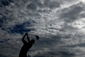Xander Schauffele of the United States tees off at the 4th.
