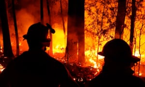 Firefighters monitor blazes and begin backburns between the towns of Orbost and Lakes Entrance in East Gipplsland on Thursday. urged to leave as conditions are expected to deteriorate from Friday