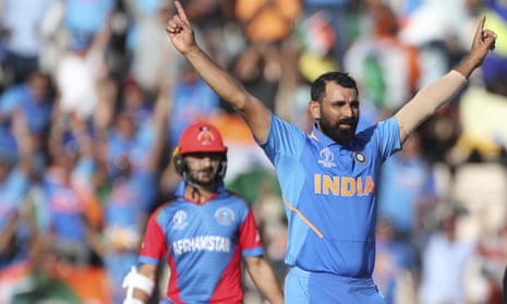 India’s Mohammed Shami, right, celebrates after dismissing Afghanistan’s Mohammad Nabi