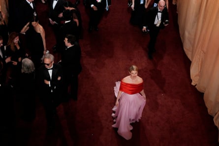 Jessie Buckley walks down the red carpet.