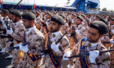 Members of the Revolutionary Guards take part in the parade before the assailants opened fire.