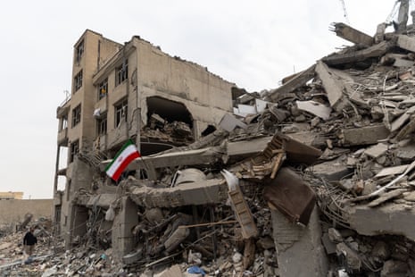 A residential building is damaged after the explosion of nearby Basij base during U.S.-Israeli strikes on Iran in eastern Tehran, Iran, on Thursday.