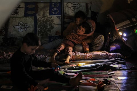 Displaced children rest in tent at Beirut stadium following Israel-Hezbollah escalation