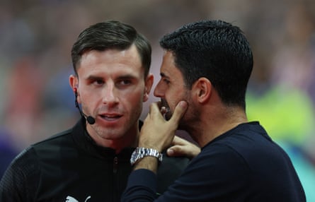 Mikel Arteta has a word with the fourth official, Elliot Bell