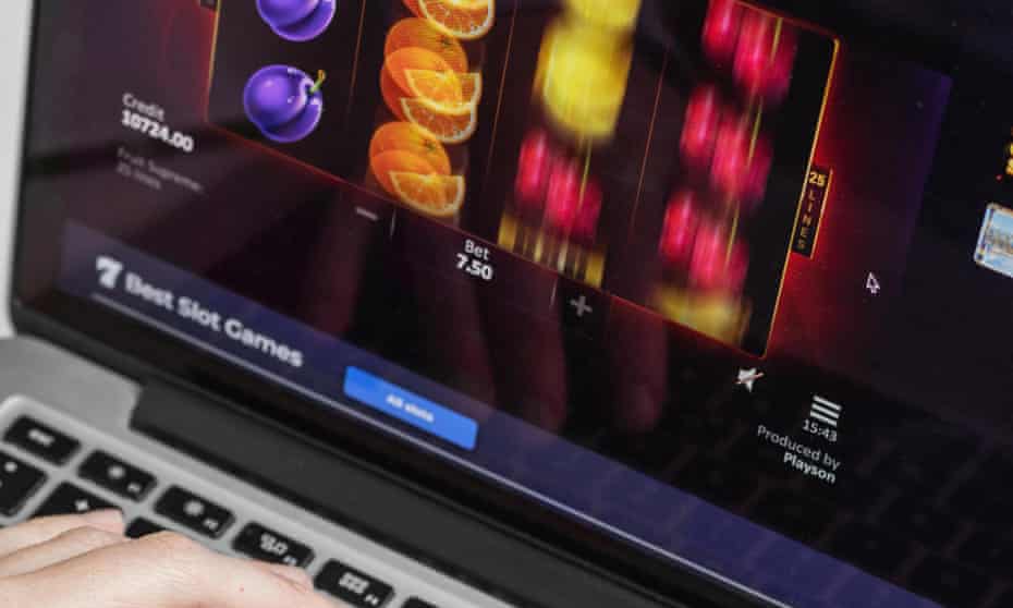 Laptop with someone playing virtual slots