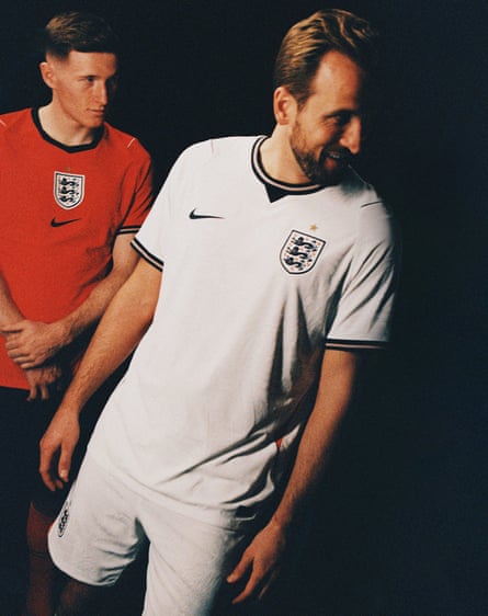 Elliot Anderson (left) and Harry Kane show off the new England home and away kits for the 2026 World Cup