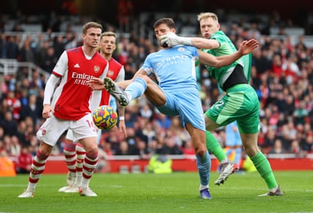 Aaron Ramsdale of Arsenal and Rúben Dias of Manchester City collide on New Year’s Day as City win 2-1 at the Emirates.