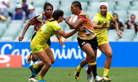 Debbie Kaore of Papua New Guinea takes on the defence in the match against Australia during day one of the 2018 Sydney Sevens at Allianz Stadium.