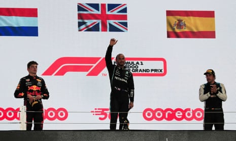 Mercedes’ Lewis Hamilton celebrates on the podium after winning.