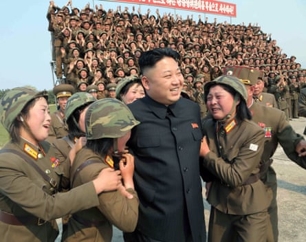 Kim Jong-un with female soldiers after the inspection of a rocket-launching drill in 2014.