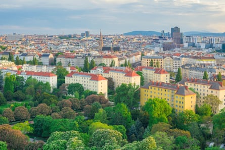 Skyline shot showing Vienna’s many large apartment blocks with a church spire one of the highest buildings in the city.