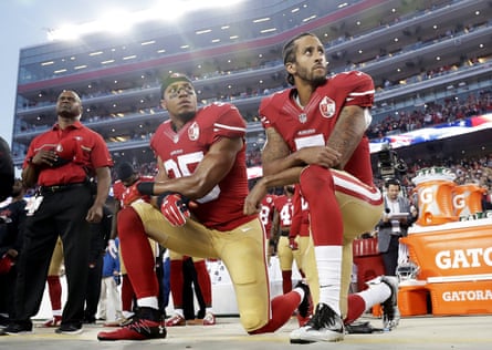 San Francisco 49ers players Eric Reid and Colin Kaepernick kneel during the national anthem before an NFL football game in Santa Clara, California, in 2016.
