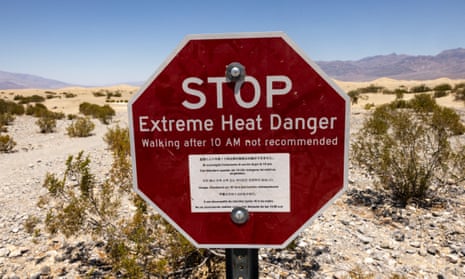 Red sign reading 'Stop Extreme Heat Danger'